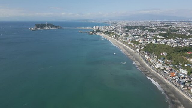 Aerial drone view of Enoshima island and blue sea on a sunny day, Japan