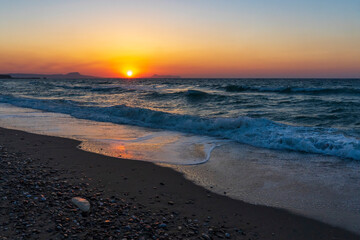A beautiful sunset at the beach of Rethymno, Crete, Greece