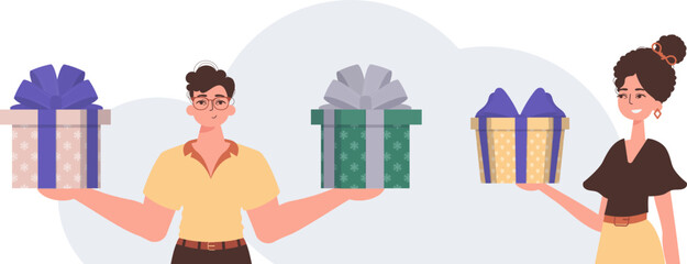 The guy and the girl are holding gifts. Christmas gift concept.