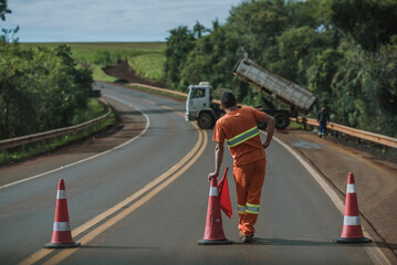 men working on the road and a truck