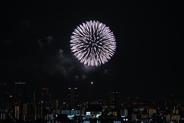 View of fireworks during a summer festival with a clear sky night (Toyonaka, Osaka, Japan) (20221203-004)