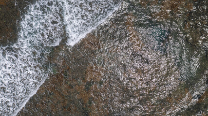 sea water and small waves over reefs