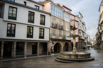 Praza do Ferro, Plaza del Hierro. Fountain the old town centre of Ourense, historic buildings and fountan on the stone streets. Galicia, Spain.