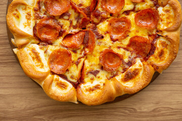 top view of haft of pepperoni pizza with cheese and crusty