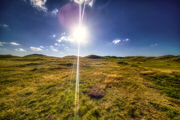 Sun over the dunes of nature reserve Het Zwanenwater, Callantsoog, The Netherlands.