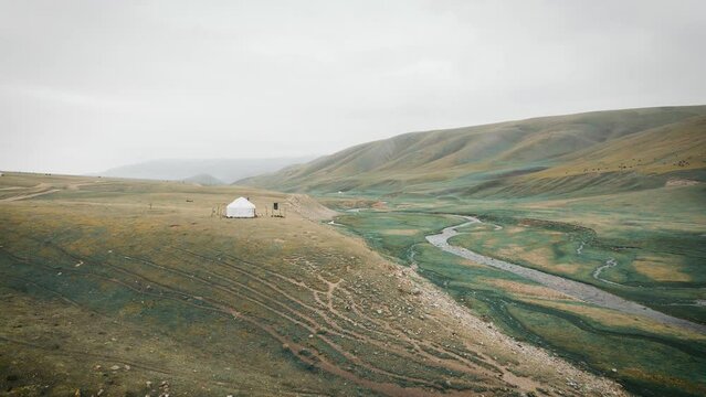 Aerial shot yurt house in the mountains
