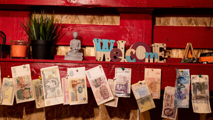 beautifully decorated shelf in the hotel with different banknotes and figurines