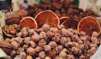 sugared nuts in a composition with orange chips