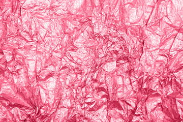 Obraz premium Viva Magenta Color of the Year 2023. Magenta background with shiny uneven surface. Background for design and creativity.