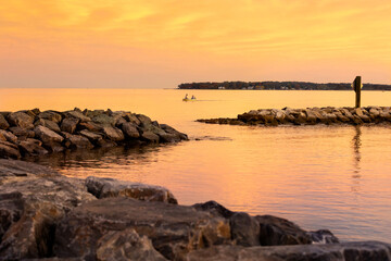 Fototapeta na wymiar motorboat with jetties at sunset