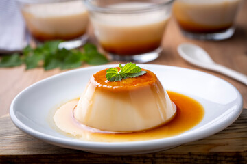 Fototapeta premium Cream caramel pudding with caramel sauce in plate