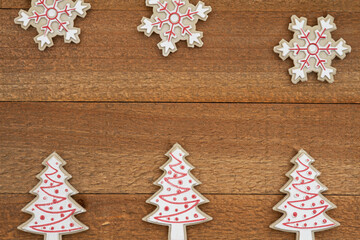 Wood snowflakes and trees on weathered wood holiday background