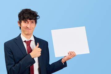 Businessman with dialogue bubble or dialogue balloon in blue flat lay.