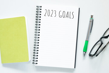 Notebook with 2023 goals text on it to apply new year resolutions and plan.