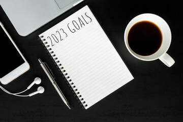Notebook with 2023 goals text on it to apply new year resolutions and plan.