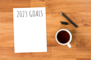Notebook with 2023 goals text on it to apply new year resolutions and plan.