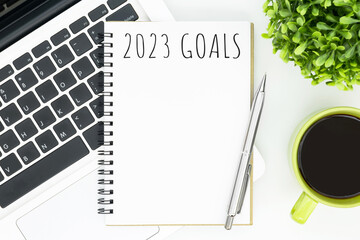 Fototapeta na wymiar Notebook with 2023 goals text on it to apply new year resolutions and plan.