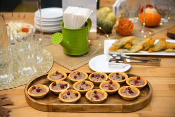 set of tartlets with pate and cranberry berries, appetizing cold snacks
