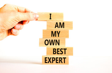 I am my own best expert symbol. Concept words I am my own best expert on wooden blocks on a beautiful white table white background. Businessman hand. Business i am my own best expert concept.