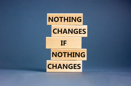 Nothing change symbol. Concept words Nothing changes if nothing changes on wooden blocks. Beautiful grey table grey background. Business nothing changes concept. Copy space.