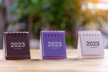 2023 Desk calendar on wooden table. Copy space