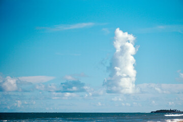 Naklejka na ściany i meble Clouds over the sea. Scenic view of beach. and clouds in Mahabalipuram, Tamilnadu, India.