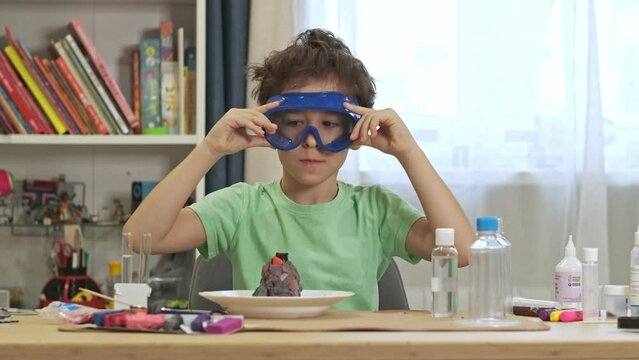 boys cientist doing experiments. Education concept. Preschooler interests. Smart little child doing chemical research at home laboratory. Dangerous experiment. Home activities for children.