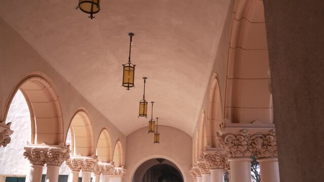 Spanish colonial revival architecture, Balboa Park, San Diego, California USA. Historic building, classic baroque or rococo romance style. Arches and columns of Casa, archway, vault, arcade or passage