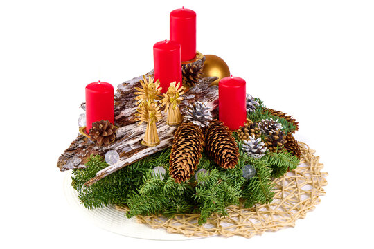 Christmas wreath with candles, isolated on white background.