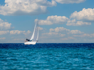 White sailboat in the sea