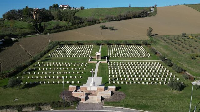 4k 24 fps aerial view of an English war cemetery in Montecchio Pesaro Urbino Marche region of Italy