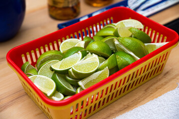 Fresh lime slices in a plastic basket