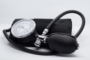 sphygmomanometer on a well lit white background