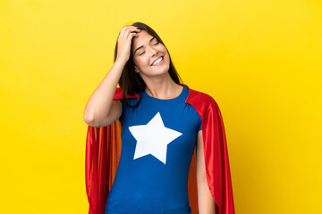 Super Hero Brazilian woman isolated on yellow background has realized something and intending the solution