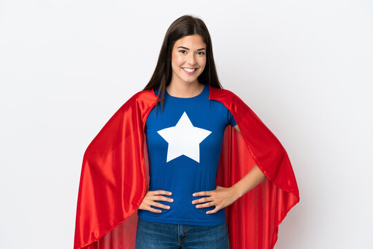 Young Brazilian woman isolated on white background in superhero costume posing with arms at hip and smiling
