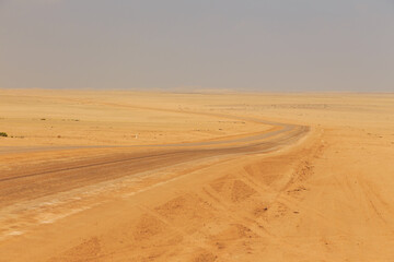 Fototapeta na wymiar Namibian landscape along the gravel road. Namib-Naukluft National Park, Namibia.