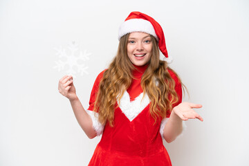 Young caucasian woman with Christmas dress holding snowflake isolated on white background with shocked facial expression