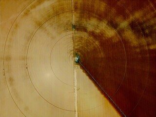 Magnificent top view of a paddock being irrigated by a center-pivot irrigation system