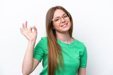 Young caucasian woman isolated on white background With glasses and doing OK sign