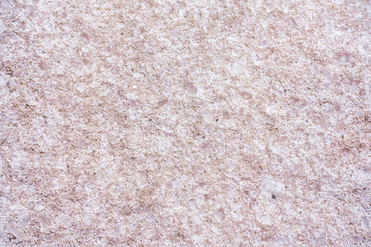 Textured background of the pink salt. Selective focus. Close up of pink salt. High quality photo