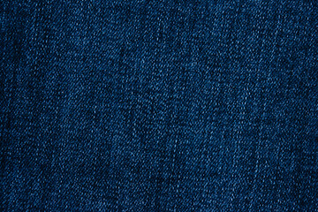 Blue denim fabric close up, denim background with copy space