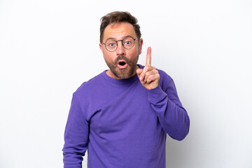 Middle age caucasian man isolated on white background intending to realizes the solution while lifting a finger up