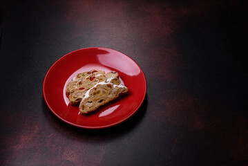 Tasty christmas stollen with marzipans, dried fruits and nuts