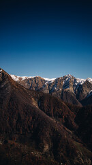 Snowy mountains against a blue sky