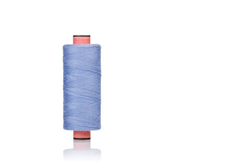 a skein of threads of blue color macro on a white background