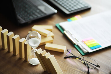 Closeup thick domino wood block in a row stop the falling, be stable in crisis, business solution concept