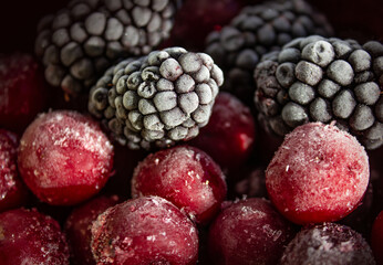 Close up of frozen mixed fruit - berries - Blackberry, Cherry. 