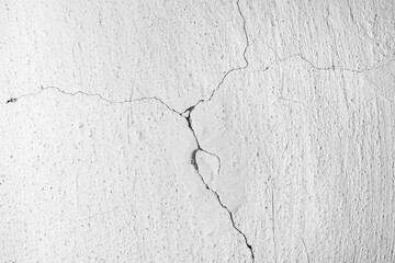 Cracks in an old concrete wall.