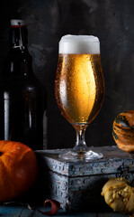 Glass of beer on a dark background