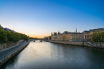 Conciergerie palace and prison by the Seine river at sunrise in Paris. France